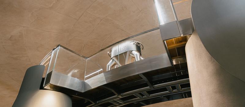Haut-Bailly cuvon set on top of walkway in vat room seen from below