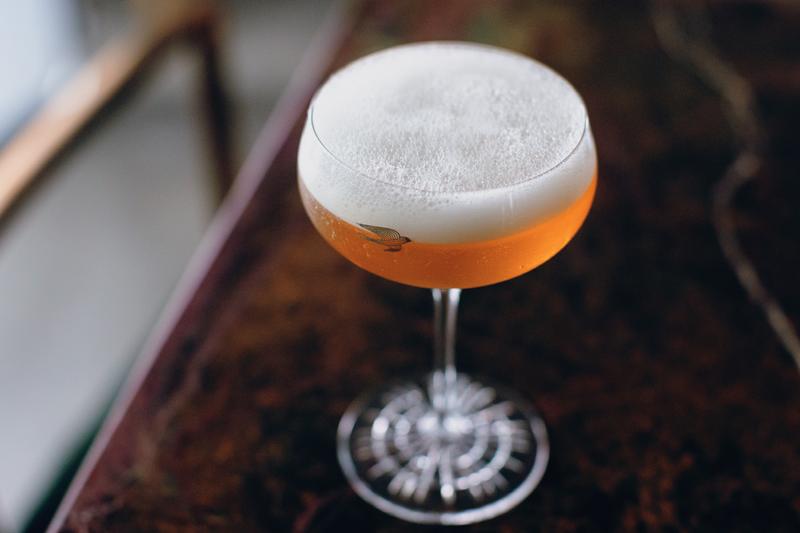Close up of foam on finished cocktail in Martell glass